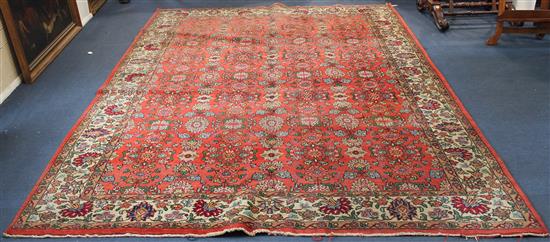Red ground Tabriz carpet, 9ft 11in by 7ft 4in(-)